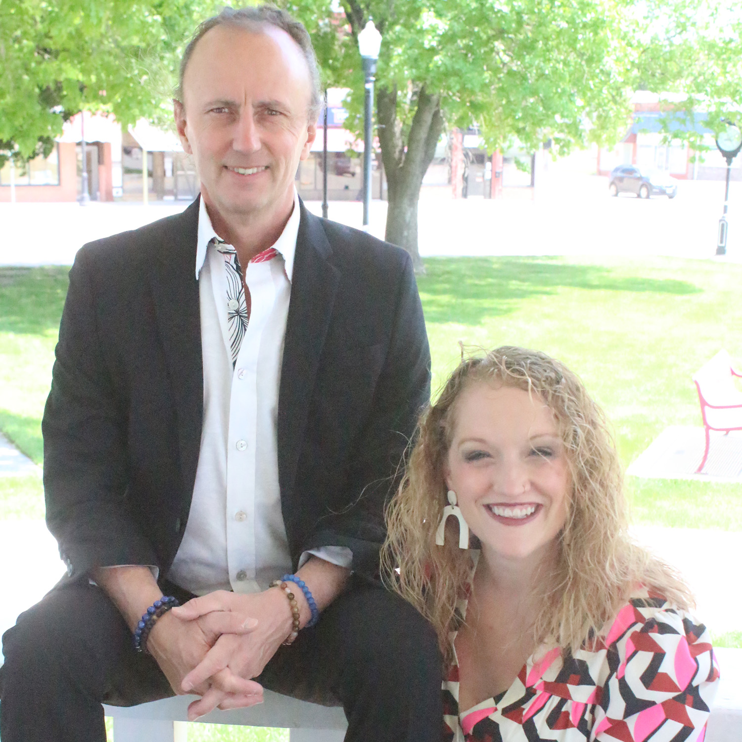 Dr. Dave Tuck and Miranda Stoll Dr. Dave Tuck and Miranda Stoll sitting on a bench in a park
